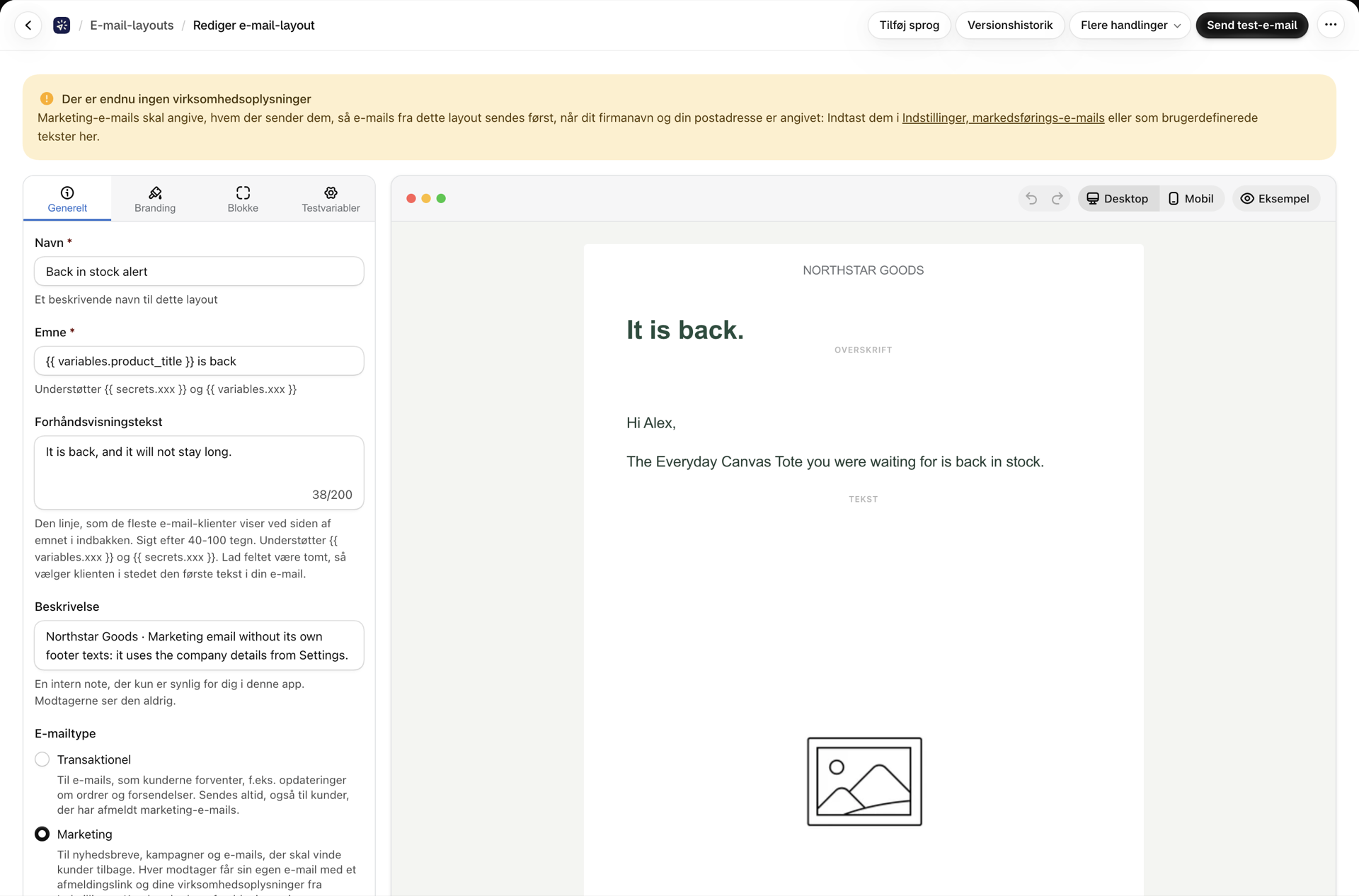 Et marketinglayout i den visuelle editor med advarselsbanneret »Der er endnu ingen virksomhedsoplysninger« ovenover