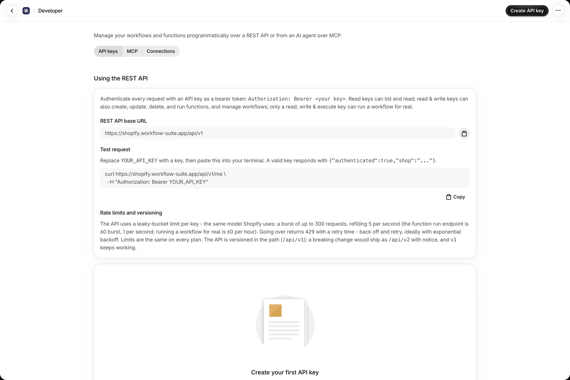 The Developer page, tab API keys: the REST API base URL, a curl test request with a Bearer placeholder, the rate limits and versioning text, and the Create API key button